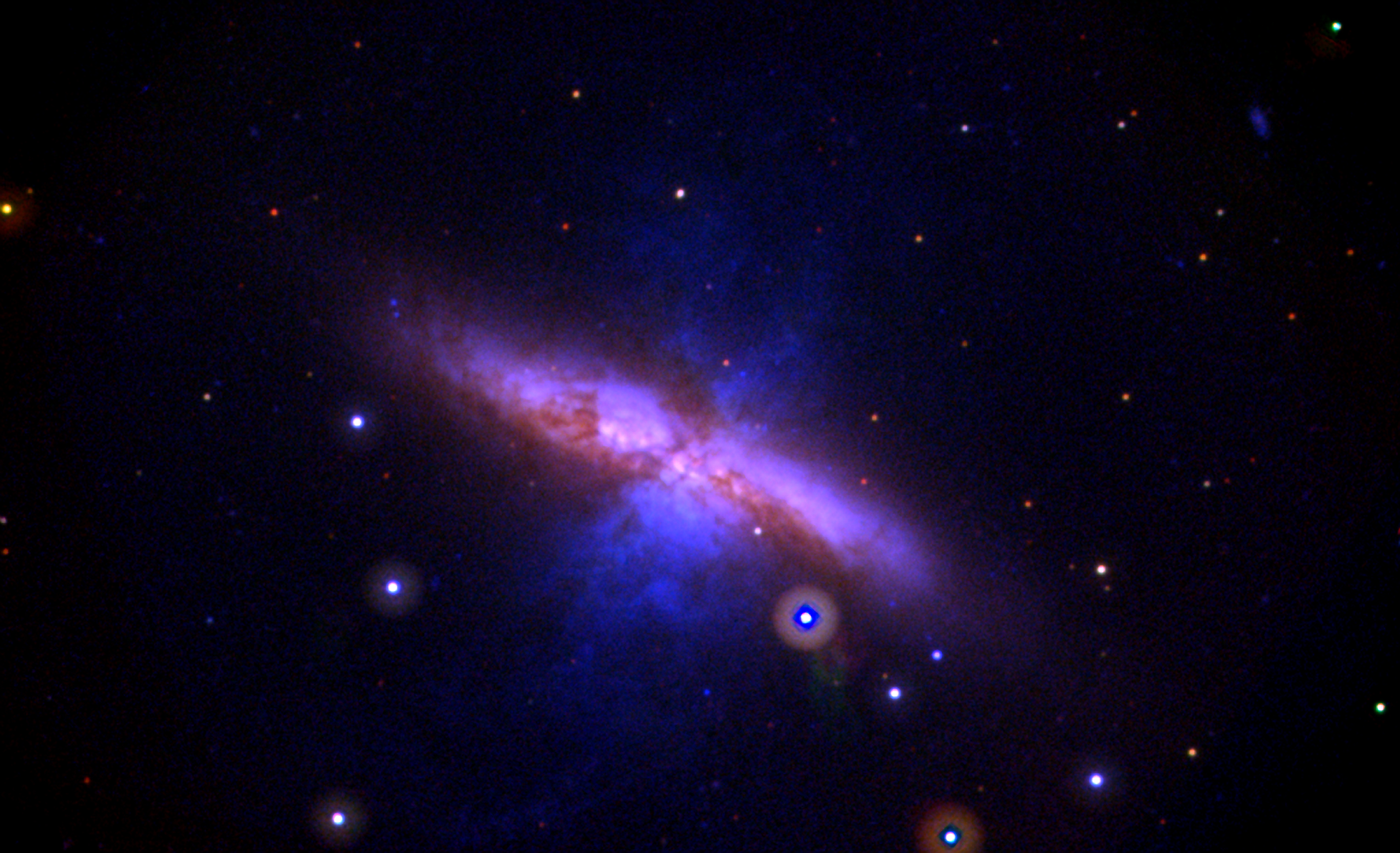 This Swift UVOT image shows galaxy M82 before the explosion and combines data acquired between 2007 and 2013. Mid-ultraviolet light is shown in blue, near-UV light in green and visible light in red. The image is 17 arcminutes across, or slightly more than This Swift UVOT image shows galaxy M82 before the explosion and combines data acquired between 2007 and 2013. Mid-ultraviolet light is shown in blue, near-UV light in green and visible light in red. The image is 17 arcminutes across, or slightly more than