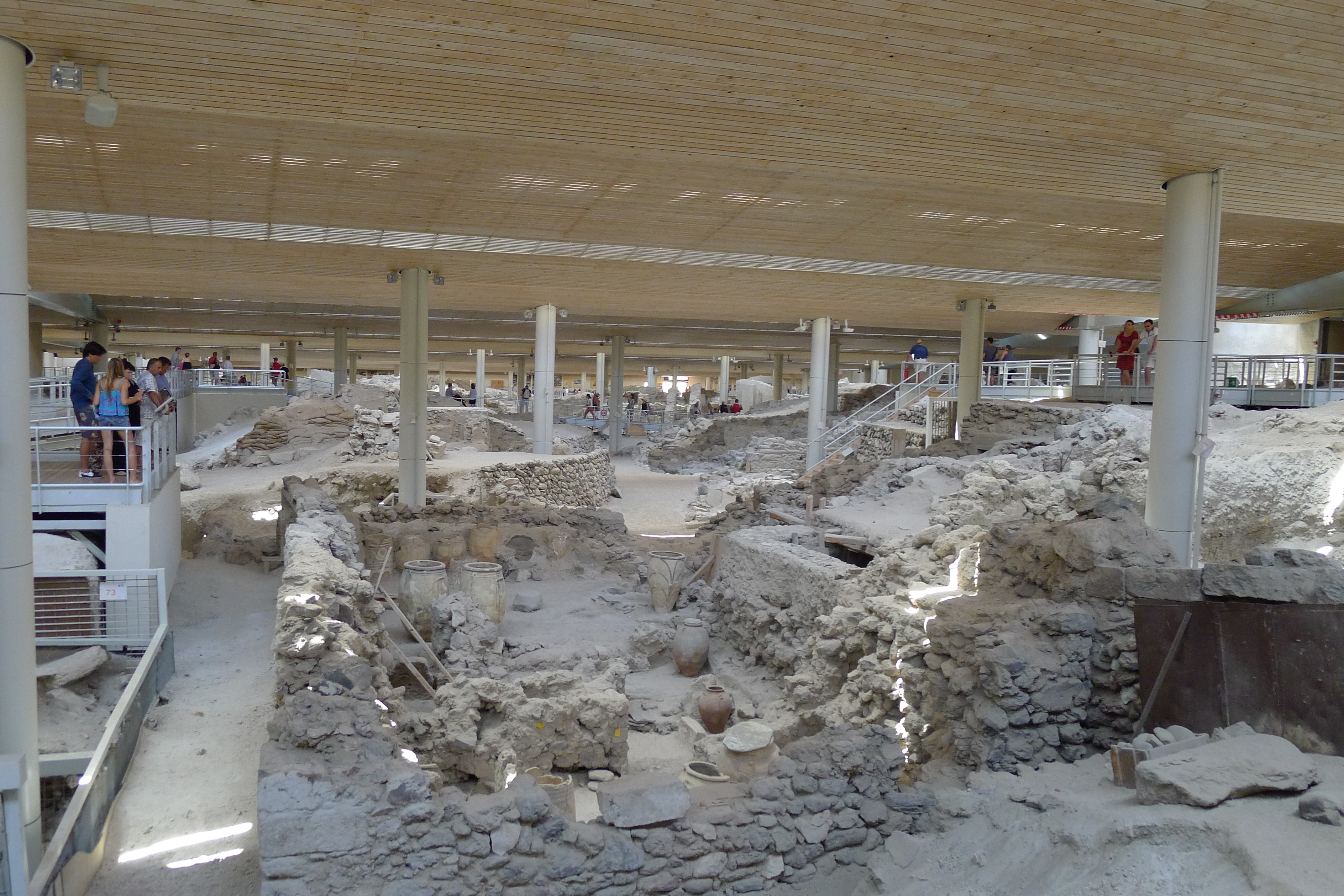 Akrotiri is the Minoan town on Santorini that was damaged by earthquakes building up to the eruption and then buried under ash once Thera erupted. The whole town site has a modern roof structure over it to protect the fragile site from the elements. Akrotiri is the Minoan town on Santorini that was damaged by earthquakes building up to the eruption and then buried under ash once Thera erupted. The whole town site has a modern roof structure over it to protect the fragile site from the elements.