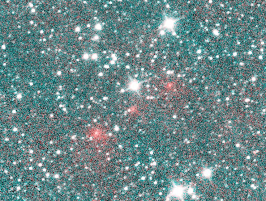 Comet NEOWISE appears as a string of fuzzy red dots crossing through the constellation Puppis in this composite image that combines multiple exposures taken by the NEOWISE mission on March 27. The comet appears red in this heat-sensitive infrared image be