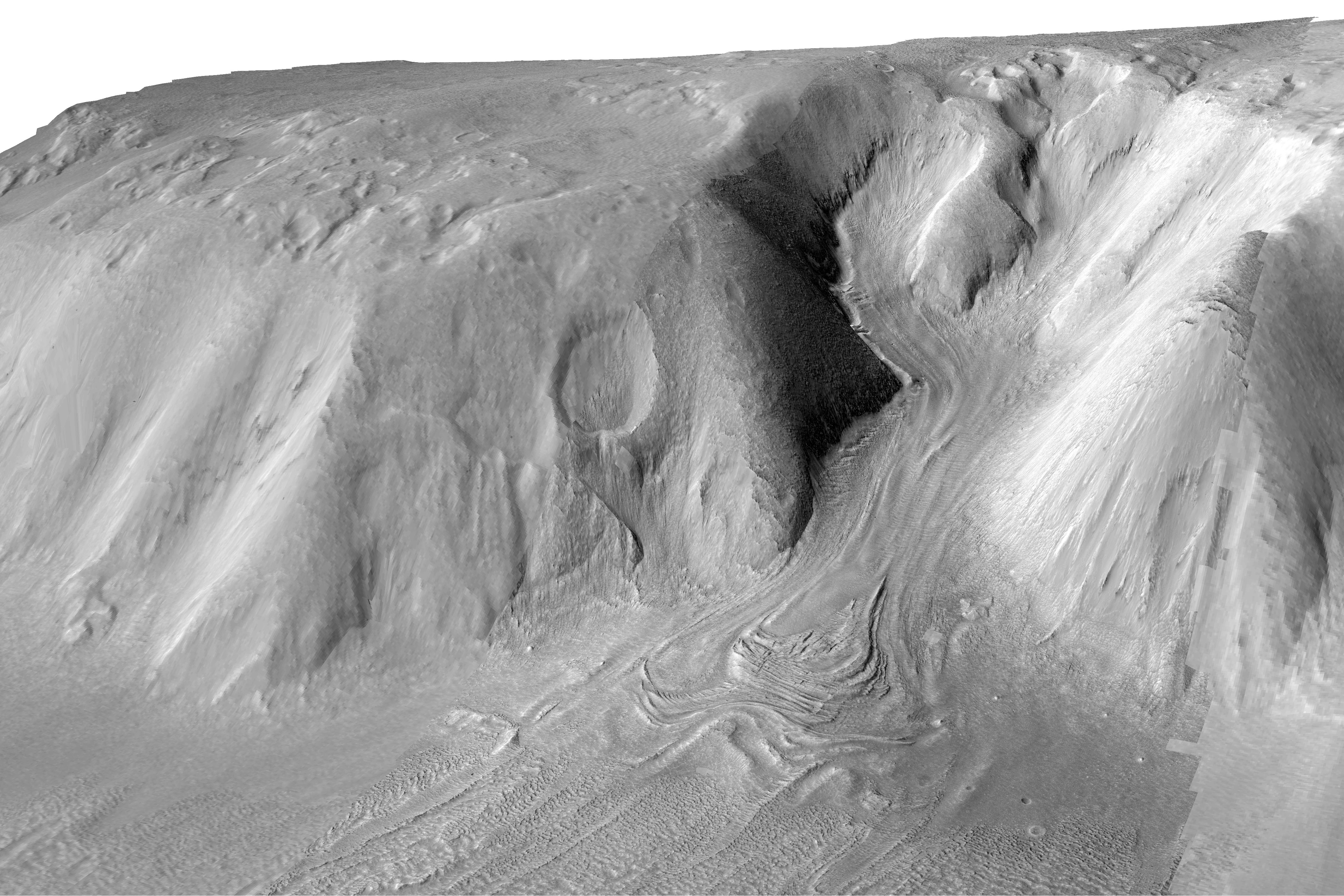 The folds, compressional ridges and flow lines on this debris-covered glacier on Mars are strikingly similar to the appearance of features on Sourdough Peak. Planetary scientists often turn to "Earth analogs" to understand what shapes landscapes on other The folds, compressional ridges and flow lines on this debris-covered glacier on Mars are strikingly similar to the appearance of features on Sourdough Peak. Planetary scientists often turn to "Earth analogs" to understand what shapes landscapes on other