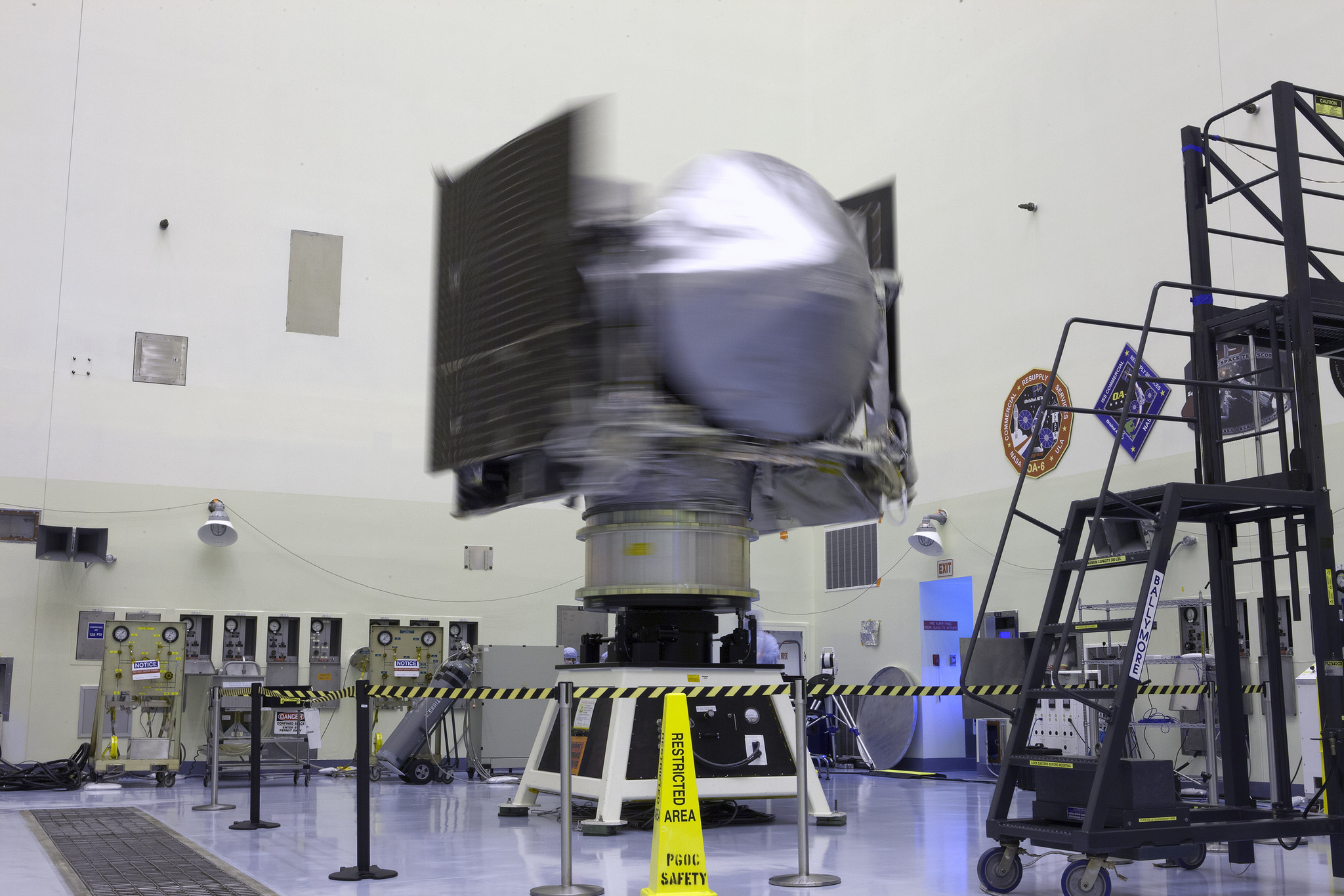 NASA's OSIRIS-REx spacecraft rotates on a spin table during a weight and center of gravity test inside the Payload Hazardous Servicing Facility at Kennedy Space Center in Florida. The spacecraft is being prepared for its scheduled launch on Sept. 8. NASA's OSIRIS-REx spacecraft rotates on a spin table during a weight and center of gravity test inside the Payload Hazardous Servicing Facility at Kennedy Space Center in Florida. The spacecraft is being prepared for its scheduled launch on Sept. 8.