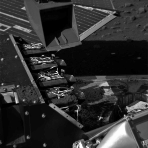 This image taken by the Surface Stereo Imager on NASA's Phoenix Mars Lander shows the lander's Robotic Arm scoop positioned over the Wet Chemistry Lab Cell 1 delivery funnel on Sol 41, the 42nd Martian day after landing, or July 6, 2008, after a soil sample was delivered to the instrument.
The instrument's Cell 1 is second one from the foreground of the image. The first cell, Cell 0, received a soil sample two weeks earlier.
This image has been enhanced to brighten the scene. This image taken by the Surface Stereo Imager on NASA's Phoenix Mars Lander shows the lander's Robotic Arm scoop positioned over the Wet Chemistry Lab Cell 1 delivery funnel on Sol 41, the 42nd Martian day after landing, or July 6, 2008, after a soil sample was delivered to the instrument.
The instrument's Cell 1 is second one from the foreground of the image. The first cell, Cell 0, received a soil sample two weeks earlier.
This image has been enhanced to brighten the scene.