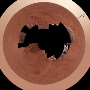 This view combines more than 400 images taken during the first several weeks after NASA's Phoenix Mars Lander arrived on an arctic plain at 62.22 degrees north latitude, 234.25 degrees east longitude on Mars. The full-circle panorama in approximately true color shows the polygonal patterning of ground at the landing area, similar to patterns in permafrost areas on Earth. South is toward the top. Trenches where Phoenix's robotic arm has been exposing subsurface material are visible in the lower half of the image. The spacecraft's meteorology mast, topped by the telltale wind gauge, extends into the sky portion of the panorama. This view comprises more than 100 different camera pointings, with images taken through three different filters at each pointing. It is presented here as a polar projection. This view combines more than 400 images taken during the first several weeks after NASA's Phoenix Mars Lander arrived on an arctic plain at 62.22 degrees north latitude, 234.25 degrees east longitude on Mars. The full-circle panorama in approximately true color shows the polygonal patterning of ground at the landing area, similar to patterns in permafrost areas on Earth. South is toward the top. Trenches where Phoenix's robotic arm has been exposing subsurface material are visible in the lower half of the image. The spacecraft's meteorology mast, topped by the telltale wind gauge, extends into the sky portion of the panorama. This view comprises more than 100 different camera pointings, with images taken through three different filters at each pointing. It is presented here as a polar projection.