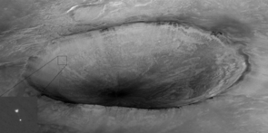 Mars Reconnaissance Orbiter's High Resolution Imaging Science Experiment (HiRISE) camera acquired this image of Phoenix hanging from its parachute as it descended to the Martian surface. Shown here is a 10 kilometer (6 mile) diameter crater informally called "Heimdall," and an improved full-resolution image of the parachute and lander. Although it appears that Phoenix is descending into the crater, it is actually about 20 kilometers (about 12 miles) in front of the crater. (Image by: NASA/JPL-Caltech/University of Arizona) Mars Reconnaissance Orbiter's High Resolution Imaging Science Experiment (HiRISE) camera acquired this image of Phoenix hanging from its parachute as it descended to the Martian surface. Shown here is a 10 kilometer (6 mile) diameter crater informally called "Heimdall," and an improved full-resolution image of the parachute and lander. Although it appears that Phoenix is descending into the crater, it is actually about 20 kilometers (about 12 miles) in front of the crater. (Image by: NASA/JPL-Caltech/University of Arizona)