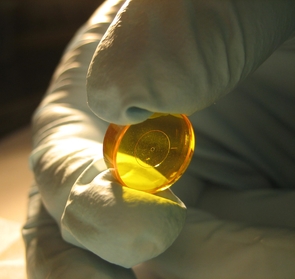 (Click image to enlarge) Similar in size and shape to a cough drop, the Apodizing Phase Plate (APP) causes light waves coming from a star to interfere with each other, exposing the faint glow of a nearby planet. Shown here is an early version. (Click image to enlarge) Similar in size and shape to a cough drop, the Apodizing Phase Plate (APP) causes light waves coming from a star to interfere with each other, exposing the faint glow of a nearby planet. Shown here is an early version.