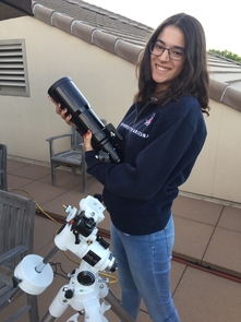 Adriana Mitchell holds one of the CATE telescopes during a practice run. During the total eclipse, 68 identical instruments will work in sync to photograph the sun's corona over an unprecedented time. (Photo courtesy of Padma Yanamandra-Fisher) Adriana Mitchell holds one of the CATE telescopes during a practice run. During the total eclipse, 68 identical instruments will work in sync to photograph the sun's corona over an unprecedented time. (Photo courtesy of Padma Yanamandra-Fisher)