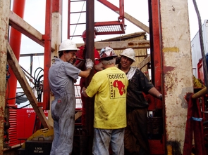 UA geoscientist Andrew Cohen (far left), Marshall Pardey and Doug Schnurrenberger stand by the coring equipment and listen for the coring tool within the drill string. (Photo courtesy of the Lake Malawi Drilling Project) UA geoscientist Andrew Cohen (far left), Marshall Pardey and Doug Schnurrenberger stand by the coring equipment and listen for the coring tool within the drill string. (Photo courtesy of the Lake Malawi Drilling Project)