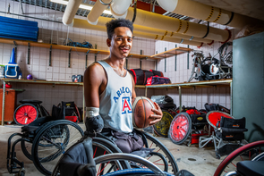 Josh Brewer in the UA Men's Wheelchair Basketball Team's equipment room at the Student Recreation Center. (Photo: Bob Demers/UANews) Josh Brewer in the UA Men's Wheelchair Basketball Team's equipment room at the Student Recreation Center. (Photo: Bob Demers/UANews)