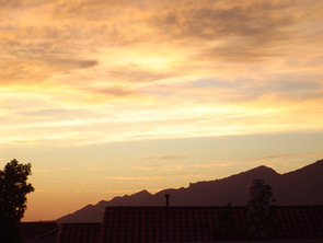 (Click to enlarge) The gently sloping ridgeline of the Santa Catalina Mountains may represent the bottom of a low-angle normal fault. The rocks that are now the Tucson Mountains were once on top of the Santa Catalinas before sliding off to the west to become the Tucson Mountains. (Credit: Richard A. Bennett) Catalina sunset