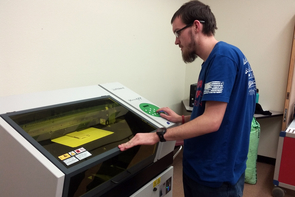 Josh Garrison, a senior at Blue Ridge High School, uses the Roland UV flatbed printer. Josh Garrison, a senior at Blue Ridge High School, uses the Roland UV flatbed printer.