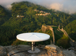 (Click to enlarge) An antenna for receiving GPS signals in a geodesy network located in northern Italy. Copyright 2006 Sigrún Hreinsdóttir. GPS disk