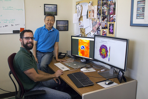 Thomas Galarneau (left) and Xubin Zeng look at the 2017 hurricane season from two different perspectives. Galanreau studies the short, one-to-two-week windows of activity, while Zeng takes a long-term approach to research and forecasting. (Photo: Stacy Pigott/UA News) Thomas Galarneau (left) and Xubin Zeng look at the 2017 hurricane season from two different perspectives. Galanreau studies the short, one-to-two-week windows of activity, while Zeng takes a long-term approach to research and forecasting. (Photo: Stacy Pigott/UA News)