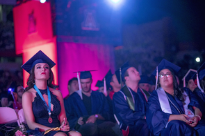 Paris Prynkiewicz, a psychology honors student from Phoenix, listens to the speakers at Commencement. (Photo: John de Dios/UANews) Paris Prynkiewicz, a psychology honors student from Phoenix, listens to the speakers at Commencement. (Photo: John de Dios/UANews)