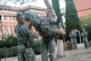 Maurissa Wortham clips onto the one rope bridge with help from cadets David Smith (left) and Jacob Denno. In the background observing are cadets Kendall Johnson and Jamee Wohle. Maurissa Wortham clips onto the one rope bridge with help from cadets David Smith (left) and Jacob Denno. In the background observing are cadets Kendall Johnson and Jamee Wohle.