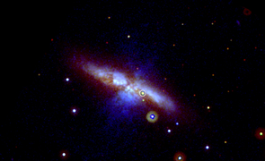 Swift's UVOT captured the new supernova (circled) in three exposures taken on Jan. 22, 2014. Mid-ultraviolet light is shown in blue, near-UV light in green and visible light in red. Thick dust in M82 scatters much of the highest-energy light, which is why the supernova appears yellowish here. The image is 17 arcminutes across, or slightly more than half the apparent diameter of a full moon. (Credit: NASA/Swift/P. Brown, TAMU) Swift's UVOT captured the new supernova (circled) in three exposures taken on Jan. 22, 2014. Mid-ultraviolet light is shown in blue, near-UV light in green and visible light in red. Thick dust in M82 scatters much of the highest-energy light, which is why the supernova appears yellowish here. The image is 17 arcminutes across, or slightly more than half the apparent diameter of a full moon. (Credit: NASA/Swift/P. Brown, TAMU)