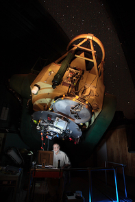 (Click image to enlarge) Robert McMillan observing with an experimental instrument unrelated to his
asteroid work in 2007, in the dome of the Steward Observatory's 2.3-meter Bok Telescope on Kitt Peak. (Photo: Dave Harvey/Steward Observatory) (Click image to enlarge) Robert McMillan observing with an experimental instrument unrelated to his
asteroid work in 2007, in the dome of the Steward Observatory's 2.3-meter Bok Telescope on Kitt Peak. (Photo: Dave Harvey/Steward Observatory)