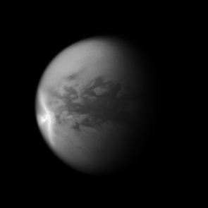 A huge arrow-shaped storm blows across the equatorial region of Titan in this image from NASA's Cassini spacecraft, chronicling the seasonal weather changes on Saturn's largest moon. (Credit: NASA/JPL/SSI) A huge arrow-shaped storm blows across the equatorial region of Titan in this image from NASA's Cassini spacecraft, chronicling the seasonal weather changes on Saturn's largest moon. (Credit: NASA/JPL/SSI)