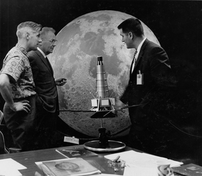 (From left) Lunar researcher Ewen Whitaker, astronomer Gerard Kuiper, both from the UA Lunar and Planetary Lab, with Raymond Heacock from NASA's Jet Propulsion Lab, posing with a model of the Ranger spacecraft used for early moon missions. The same moon hemisphere model behind them is on display at Flandrau. (From left) Lunar researcher Ewen Whitaker, astronomer Gerard Kuiper, both from the UA Lunar and Planetary Lab, with Raymond Heacock from NASA's Jet Propulsion Lab, posing with a model of the Ranger spacecraft used for early moon missions. The same moon hemisphere model behind them is on display at Flandrau.