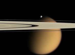 This image taken by the Cassini orbiter on Oct. 15, 2007, shows Saturn's A and F rings, the small moon Epimetheus and smog-enshrouded Titan, the planet's
largest moon. The image is colorized to approximate the scene as it might appear to human eyes. (Credit: NASA/JPL/Space Science Institute; Click to enlarge) This image taken by the Cassini orbiter on Oct. 15, 2007, shows Saturn's A and F rings, the small moon Epimetheus and smog-enshrouded Titan, the planet's
largest moon. The image is colorized to approximate the scene as it might appear to human eyes. (Credit: NASA/JPL/Space Science Institute; Click to enlarge)