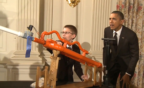 President Barack Obama and 16-year-old Joey Hudy take aim for a demonstration of a high-powered marshmallow gun during the first White House Maker Faire. President Barack Obama and 16-year-old Joey Hudy take aim for a demonstration of a high-powered marshmallow gun during the first White House Maker Faire.