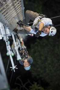 High above the rainforest canopy, UA scientists Scott Saleska (in foreground) and Neill Prohaska, a UA doctoral student, ascend a 220-foot-tall flux tower in the middle of their study site. Sensors on the tower measure the carbon dioxide and water vapor that flow into and out of the forest. (Photo: Corey Rich) High above the rainforest canopy, UA scientists Scott Saleska (in foreground) and Neill Prohaska, a UA doctoral student, ascend a 220-foot-tall flux tower in the middle of their study site. Sensors on the tower measure the carbon dioxide and water vapor that flow into and out of the forest. (Photo: Corey Rich)