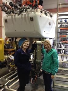Hurwitz and Amy Apprill, associate scientist at Woods Hole Oceanographic Institution, in front of the human-piloted Alvin submersible. Deep-water samples are collected using the pod's robotic arm because the pressure of the water is too intense for divers. (Photo: Stefan Sievert, Woods Hole Oceanographic Institution) Hurwitz and Amy Apprill, associate scientist at Woods Hole Oceanographic Institution, in front of the human-piloted Alvin submersible. Deep-water samples are collected using the pod's robotic arm because the pressure of the water is too intense for divers. (Photo: Stefan Sievert, Woods Hole Oceanographic Institution)