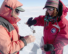 Julia Goreva (right) and a colleague demonstrate proper meteorite collecting technique by using tongs to place meteorites in sterile plastic collecting bags. (Photo courtesy of Julia Goreva, UA Lunar and Planetary Laboratory). Julia Goreva (right) and a colleague demonstrate proper meteorite collecting technique by using tongs to place meteorites in sterile plastic collecting bags. (Photo courtesy of Julia Goreva, UA Lunar and Planetary Laboratory).