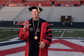 University President Robert C. Robbins addressed the audience in video clips filmed at locations around campus, including Arizona Stadium. "The new format of celebration this year is out of necessity, and we know it's not traditional; however, commitment to celebrating your achievement is as robust as ever," he said. (Photo: Chris Richards/University of Arizona) University President Robert C. Robbins addressed the audience in video clips filmed at locations around campus, including Arizona Stadium. "The new format of celebration this year is out of necessity, and we know it's not traditional; however, commitment to celebrating your achievement is as robust as ever," he said. (Photo: Chris Richards/University of Arizona)