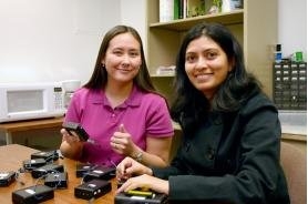 Assistant professor Susan Lysecky, left, and graduate student Anuradha Phalke demonstrate some of the eBlocks they have designed and built. They hope these eBlocks, which can be hooked together to make electronics projects and test equipment, will show today’s middle school students that science and math are not only worth studying – but fun and exciting, too. (Photo by Matt Brailey) Assistant professor Susan Lysecky, left, and graduate student Anuradha Phalke demonstrate some of the eBlocks they have designed and built. They hope these eBlocks, which can be hooked together to make electronics projects and test equipment, will show today’s middle school students that science and math are not only worth studying – but fun and exciting, too. (Photo by Matt Brailey)
