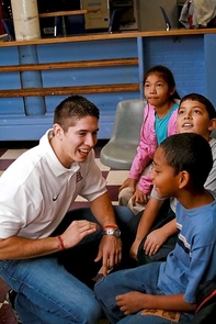 Quarterback Kris Heavner jokes with Damien Lewis, a third-grader at Pueblo Gardens Elementary, while Emilio Grijalva and Jamme Tran, both fourth-graders at Pueblo Gardens, check their bowling scores. Quarterback Kris Heavner jokes with Damien Lewis, a third-grader at Pueblo Gardens Elementary, while Emilio Grijalva and Jamme Tran, both fourth-graders at Pueblo Gardens, check their bowling scores.