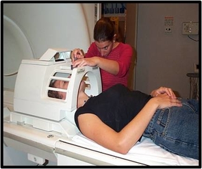 This photo illustrates how subjects are prepared for an fMRI scan. (Photo courtesy UA Neuroimaging Laboratory) This photo illustrates how subjects are prepared for an fMRI scan. (Photo courtesy UA Neuroimaging Laboratory)