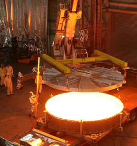 Casting of a 4 meter mirror substrate made of "Zerodur" glass ceramic on June 2, 2006 at SCHOTT headquarters in Mainz, Germany. The molten glass is heated to more than 2,732 degrees Fahrenheit (1,500 degrees Celsius). After cooling and preliminary processing, the substrate is ceramized in an 11-month process in which the glass is transformed to glass ceramic. (Image: SCHOTT) Casting of a 4 meter mirror substrate made of "Zerodur" glass ceramic on June 2, 2006 at SCHOTT headquarters in Mainz, Germany. The molten glass is heated to more than 2,732 degrees Fahrenheit (1,500 degrees Celsius). After cooling and preliminary processing, the substrate is ceramized in an 11-month process in which the glass is transformed to glass ceramic. (Image: SCHOTT)