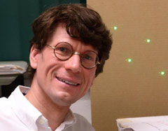 Laird Close pictured with four identical green laser SDI images. "The team that gets the first direct picture of an extrasolar planet will be the team that's cleverest with optics, cleverest with software, and cleverest with a telescope, " Close said. Laird Close pictured with four identical green laser SDI images. "The team that gets the first direct picture of an extrasolar planet will be the team that's cleverest with optics, cleverest with software, and cleverest with a telescope, " Close said.
