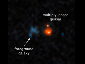 A Hubble Space Telescope image of a very distant quasar (at right) that has been brightened and split into three images by the effects of the gravitational field of a foreground galaxy (left). (Image: NASA, ESA, Xiaohui Fan/UA) A Hubble Space Telescope image of a very distant quasar (at right) that has been brightened and split into three images by the effects of the gravitational field of a foreground galaxy (left). (Image: NASA, ESA, Xiaohui Fan/UA)