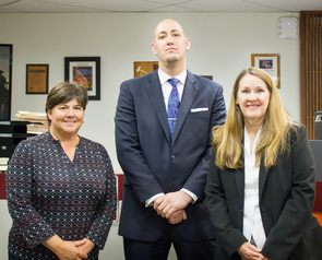 Angela Menard (left) and Lori Lewis (right) teach and supervise students such as Jonathan Rich (center) as they gain real-world experience through the Veterans' Advocacy Law Clinic and Veterans Court. (Photo: Alejandra Cardenas/UA James E. Rogers College of Law) Angela Menard (left) and Lori Lewis (right) teach and supervise students such as Jonathan Rich (center) as they gain real-world experience through the Veterans' Advocacy Law Clinic and Veterans Court. (Photo: Alejandra Cardenas/UA James E. Rogers College of Law)