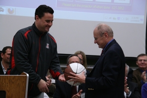 UA basketball coach Sean Miller presents a signed basketball to Jim Wyant, a longtime Wildcats basketball fan, at Tuesday's celebration. UA basketball coach Sean Miller presents a signed basketball to Jim Wyant, a longtime Wildcats basketball fan, at Tuesday's celebration.