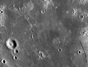 NASA's Lunar Reconnaissance Orbiter took this wide-angle photograph of Mare Nubium, a seemingly featureless expanse on the moon. The crater on the left is Bullialdus, which spans about 38 miles in diameter. (Image: NASA) NASA's Lunar Reconnaissance Orbiter took this wide-angle photograph of Mare Nubium, a seemingly featureless expanse on the moon. The crater on the left is Bullialdus, which spans about 38 miles in diameter. (Image: NASA)