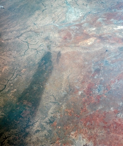 For comparison, this image of Texas obtained by astronauts aboard NASA's Gemini 4 spacecraft on June 5, 1965, shows a large dark swath attributed to rainfall. The dark areas correspond to regions that received more than one inch of rain in the days before the image was obtained. The large swath is about 16 kilometers (10 miles) across near the western (left) end. (Image: NASA/Johnson Space Center) For comparison, this image of Texas obtained by astronauts aboard NASA's Gemini 4 spacecraft on June 5, 1965, shows a large dark swath attributed to rainfall. The dark areas correspond to regions that received more than one inch of rain in the days before the image was obtained. The large swath is about 16 kilometers (10 miles) across near the western (left) end. (Image: NASA/Johnson Space Center)