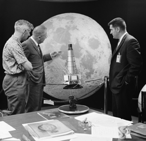 Gerard Kuiper points out features on a lunar hemisphere to team members Ewen Whitaker (left) and Ray Heacock. On the table is a model of the Ranger spacecraft, which took the first close-up images of the moon. The lunar hemisphere is on display at UA's Flandrau Science Center & Planetarium. (Photo: JPL-Caltech/NASA) Gerard Kuiper points out features on a lunar hemisphere to team members Ewen Whitaker (left) and Ray Heacock. On the table is a model of the Ranger spacecraft, which took the first close-up images of the moon. The lunar hemisphere is on display at UA's Flandrau Science Center & Planetarium. (Photo: JPL-Caltech/NASA)