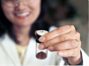 Analog "tholins" made in Mark Smith's chemistry lab. "Tholin" is a term coined by Carl Sagan (from the Greek "tholos," meaning mud) for the brown complex organics precipitating from Titan's stratospheric aerosol layers. Titan's natural tholins could be part of important surface chemistry leading to the next step toward life. (Photo: Lori Stiles, UA News) Analog "tholins" made in Mark Smith's chemistry lab. "Tholin" is a term coined by Carl Sagan (from the Greek "tholos," meaning mud) for the brown complex organics precipitating from Titan's stratospheric aerosol layers. Titan's natural tholins could be part of important surface chemistry leading to the next step toward life. (Photo: Lori Stiles, UA News)