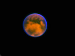 This extraordinary view of Saturn's moon, Titan, was produced with an Earth-based telescope using a new kind of camera developed by UA astronomer Laird Close. Titan is about 800 million miles away. The resolution of this image is 360 kilometers, about 200 miles. (Photo: Markus Hartung, ESO, and Laird Close, UA Steward Observatory) This extraordinary view of Saturn's moon, Titan, was produced with an Earth-based telescope using a new kind of camera developed by UA astronomer Laird Close. Titan is about 800 million miles away. The resolution of this image is 360 kilometers, about 200 miles. (Photo: Markus Hartung, ESO, and Laird Close, UA Steward Observatory)