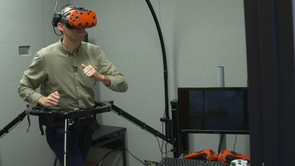 Derek Huffman navigates a virtual environment in 360 degrees on an omnidirectional treadmill. (Photo: Roy Wageman/UAHS BioCommunications) Derek Huffman navigates a virtual environment in 360 degrees on an omnidirectional treadmill. (Photo: Roy Wageman/UAHS BioCommunications)