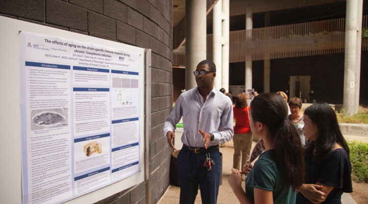 At KEYS, Eric Oum worked in the lab of Dr. Anita Koshy studying the effects of aging on the immune response to Toxoplasma gondii infection. Here, he presents his research poster at the KEYS Showcase. 