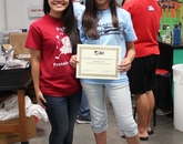 A student, Savannah (right), receives her certificate of BlastOff! camp completion from Biochemistry Club president Gloria Le. A student, Savannah (right), receives her certificate of BlastOff! camp completion from Biochemistry Club president Gloria Le.