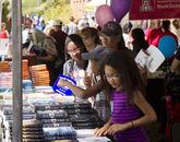Attendees shop in the UA BookStores tent. Attendees shop in the UA BookStores tent.
