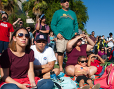 "This is history for the UA," says Samantha Rodriguez (right), a sophomore majoring in astronomy at the UA, with her husband and daughter. "Hopefully by the time I graduate, I will be able to work on something like this." (Photo credit: Ernesto Trejo/UANews) "This is history for the UA," says Samantha Rodriguez (right), a sophomore majoring in astronomy at the UA, with her husband and daughter. "Hopefully by the time I graduate, I will be able to work on something like this." (Photo credit: Ernesto Trejo/UANews)