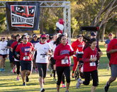 Fans of the UA and ASU football teams show their support at a 5K run. UA supporters made a stronger showing than their ASU counterparts. Fans of the UA and ASU football teams show their support at a 5K run. UA supporters made a stronger showing than their ASU counterparts.