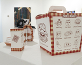"2003," an inkjet print by Chelsey Iglecias, a studio art student. "Stobburger Packaging" by Yuen Ping Sze, a studio art graduate.