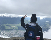 Alexis Romo, a junior psychology major, displays the Wildcat hand symbol high in the Austrian Alps during the Medieval Europe Study Tour. Alexis Romo, a junior psychology major, displays the Wildcat hand symbol high in the Austrian Alps during the Medieval Europe Study Tour.