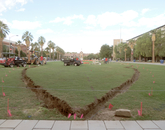 Rubberized red track creates an outline of the USS Arizona, which extends from Old Main to the Krutch Garden. The memorial includes a full-scale outline of the USS Arizona, which extends from Old Main to the Krutch Garden.